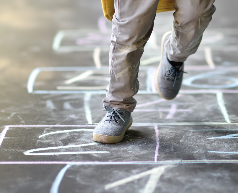Child jumping on the ground 
